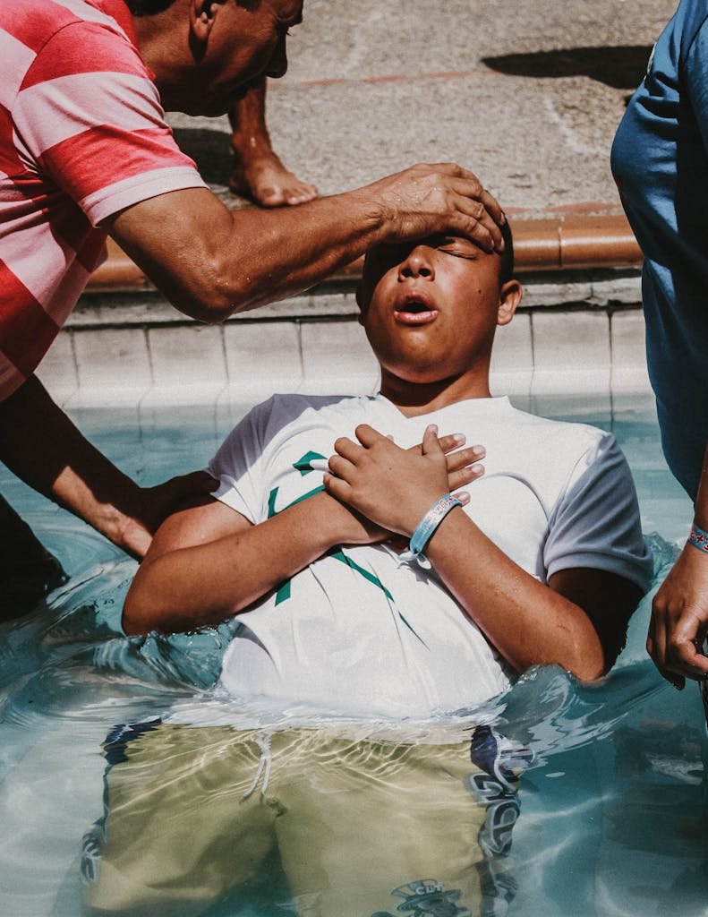 A Man Doing Christian Baptism on the Water